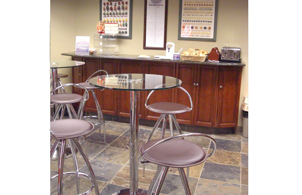 The lobby for Atlantic Aviation in Farmingdale, NY had previously been cut up into smaller rooms, and we opened them up to facilitate a more contemporary feeling.