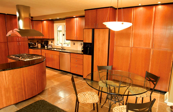 Custom built solid cherry cabinetry, a Jerusalem Stone floor and a peninsula that enables the chef to stay a part of the conversation.