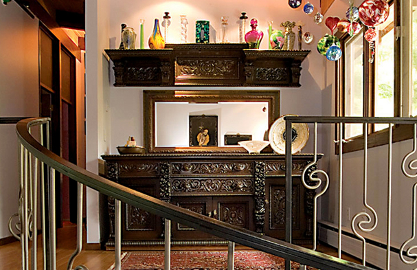 This simple but transitional railing created an eclecticism that complements the antique furniture that the client treasured.