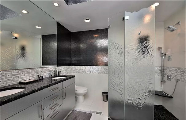 Glass shower enclosure